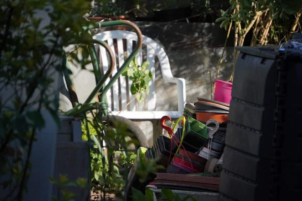 A backyard compost pile with browns and greens layered for beginner composting