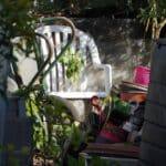 A backyard compost pile with browns and greens layered for beginner composting